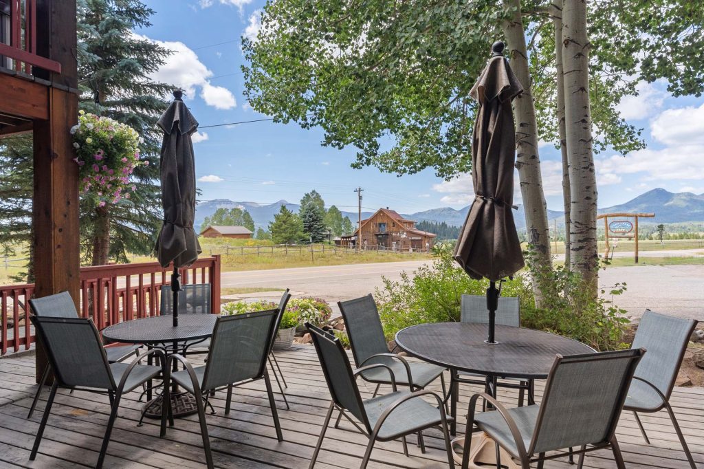 Plenty of outdoor seating and space on multiple decks to enjoy beautiful summers at True North Adventure Lodge