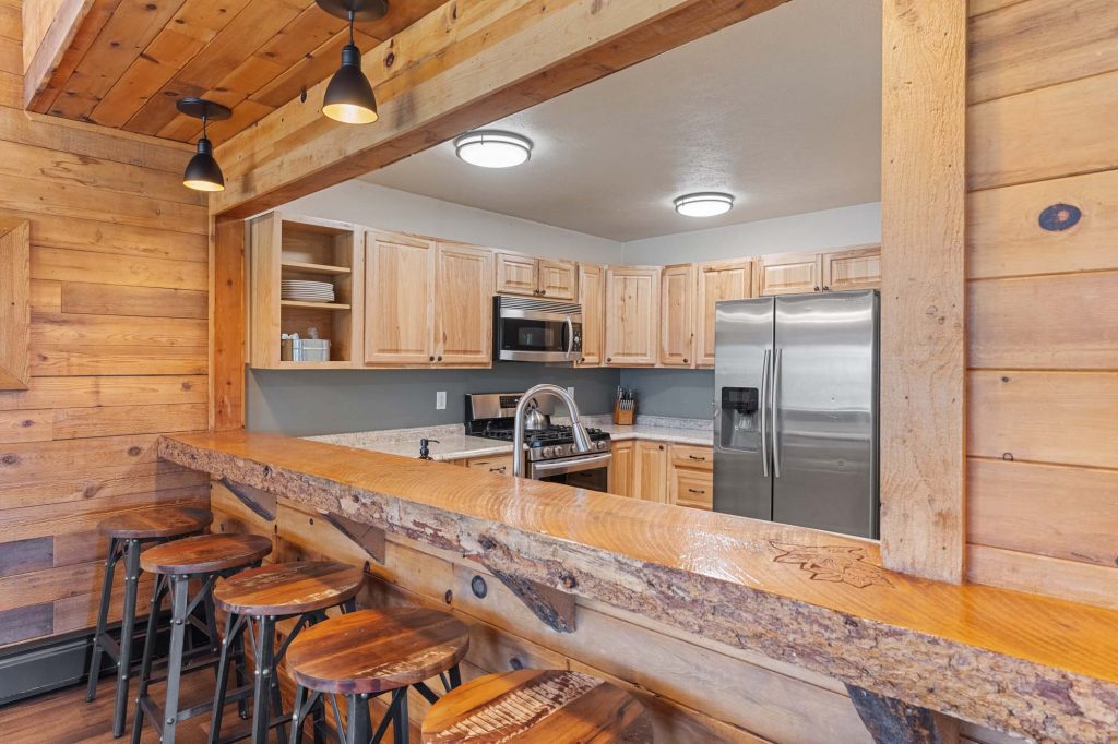 Amenities at True North Adventure Lodge include a well-stocked Kitchen with bar seating and spacious community room for large groups